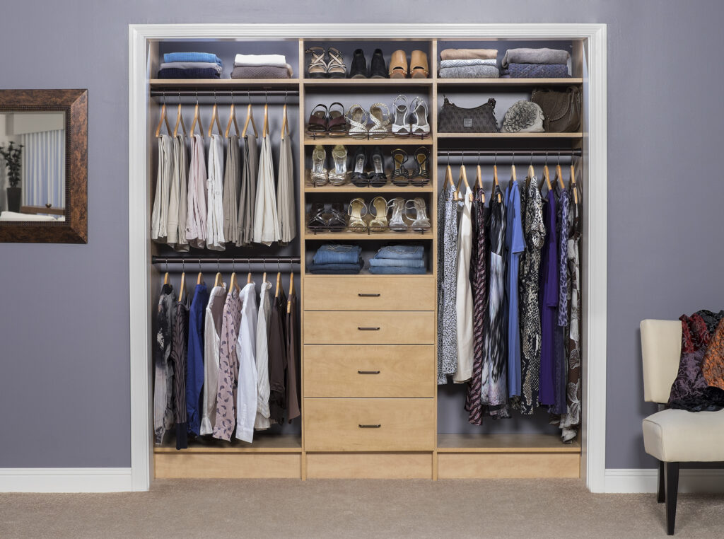 reach in closet with a mx of long hang, short hang, shelving, and drawers to maximize vertical space and improve storage