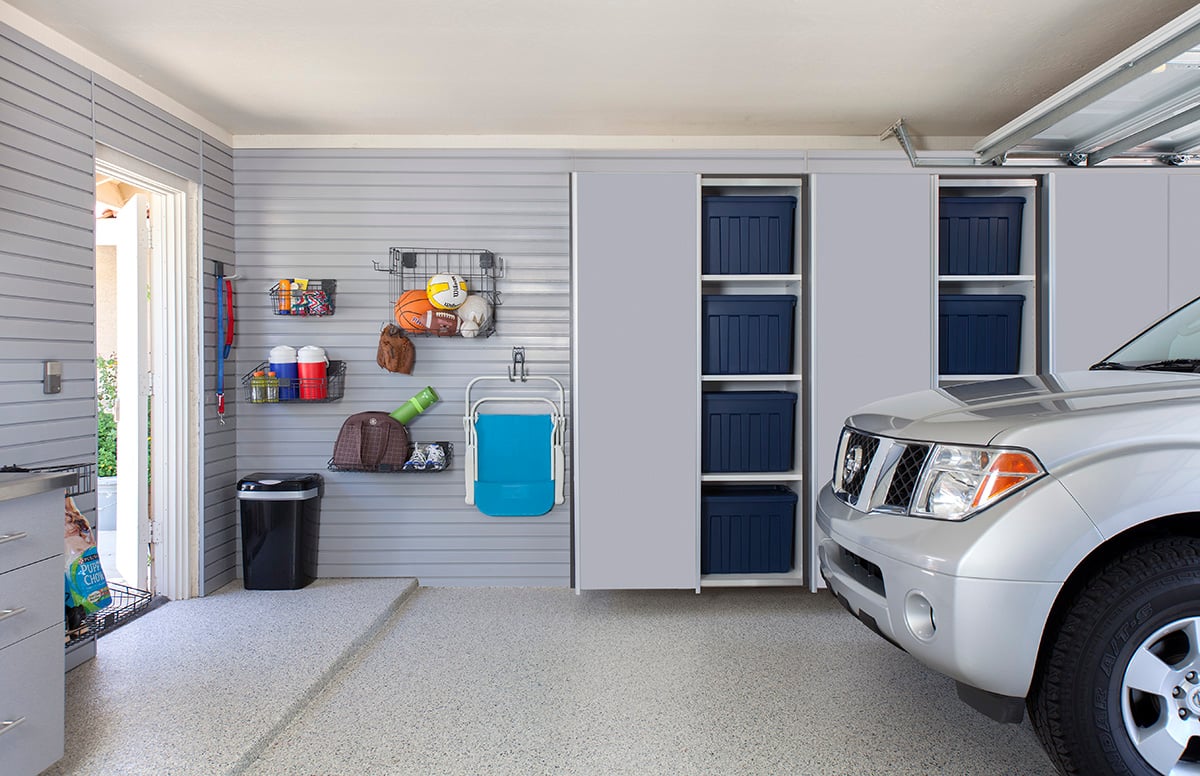 Organized Garage Storage with Cabinets and Slatwall System