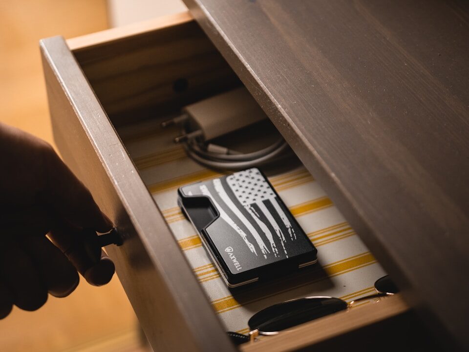 organized entry table with storage drawer for keys , wallet, phone, to prevent visual clutter